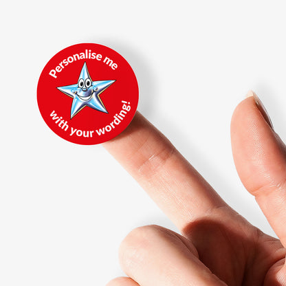Red sticker with a star graphic and text 'Personalise me with your wording!' held between fingers.