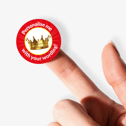 Red sticker on a finger with a gold crown on white background as a central image.  'Personalise me with your wording!' surrounds the image.