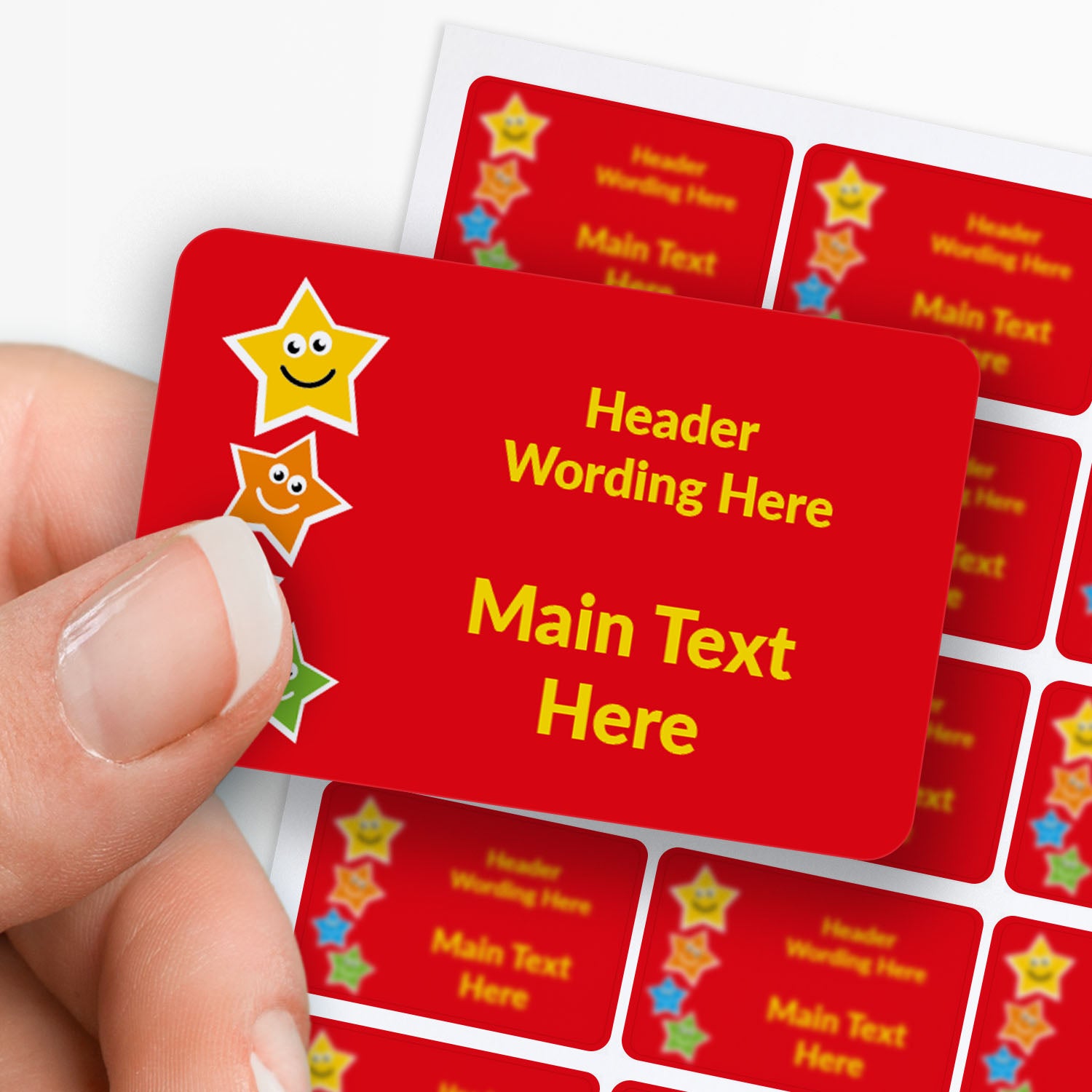 Rectangle red sticker held by finger and thumb with star decals and text