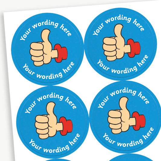 A sheet of blue stickers featuring a thumbs up in the centre.  Placeholder text 'Your wording here' is above and below the image for customisation.