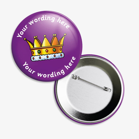 Set of ten 38mm round personalised badges featuring a gold crown replete with 5 jewels on a purple background; includes customisable white text above and below the crown, equipped with safety pin fastenings.
