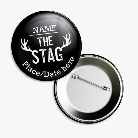 A set of ten 38mm round badges with a black background, featuring the phrase "THE STAG" in bold white capital letters at the centre, flanked by stylised white antlers; customisable white text areas are positioned above and below the central design, and the badge includes a safety pin backing.