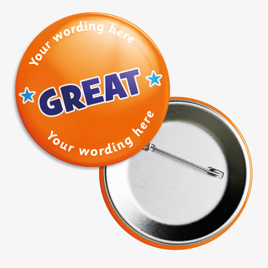Ten 50mm round badges with a bright orange background, featuring the word "GREAT" in bold blue capital letters outlined in white at the centre, flanked by two blue stars; customisable white text areas are positioned above and below the central design, and the badge includes a safety pin backing.
