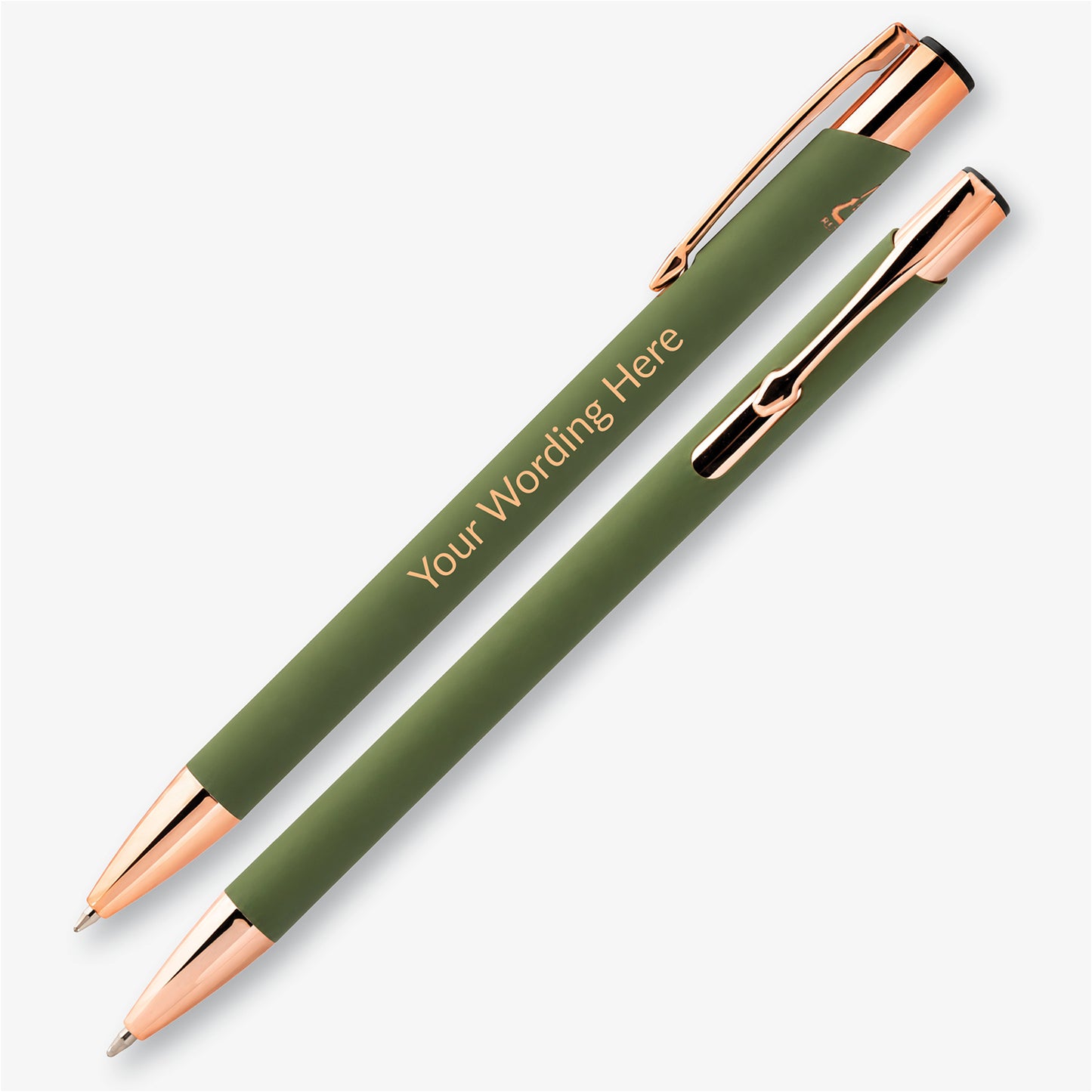 Two sage green personalised pens with rose gold detailing, showing the engraved wording and metal pocket clip.