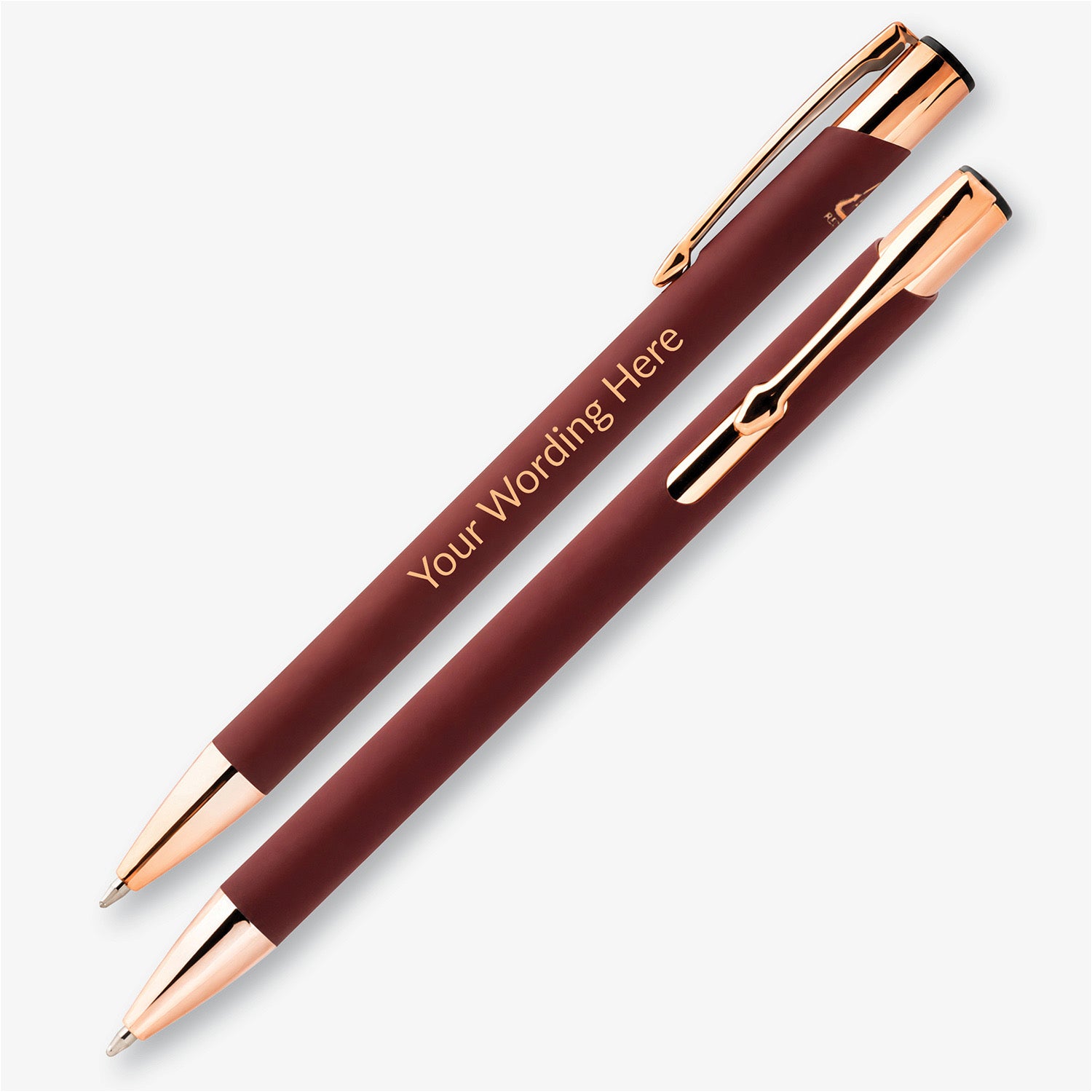 Two burgundy personalised pens with rose gold detailing, showing the engraved wording and metal pocket clip.