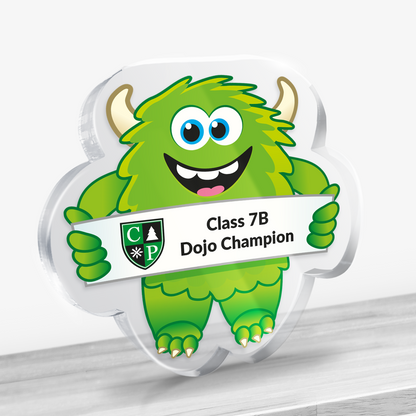 Acrylic green monster design award with example text: Class 7B Dojo Champion. Shown on a light background.