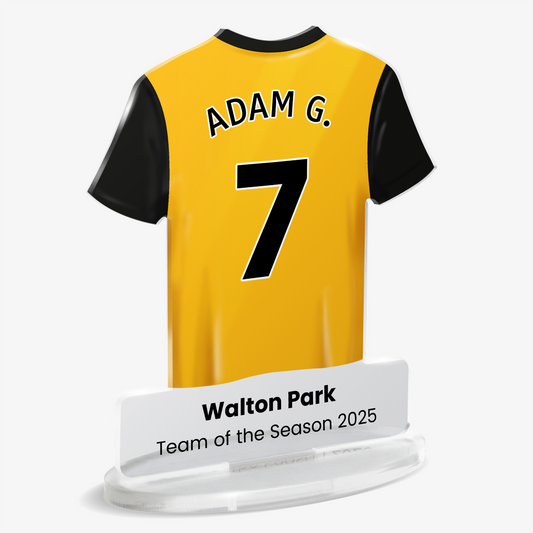 Acrylic plaque with yellow and black sports shirt with 'Adam G.' and number '7'. Award text under shirt reads 'Walton Park' 'Team of the Season 2025'. Plaque is shown on a white background