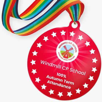 Red acrylic personalised medal with rainbow ribbon showing school logo and personalised wording.