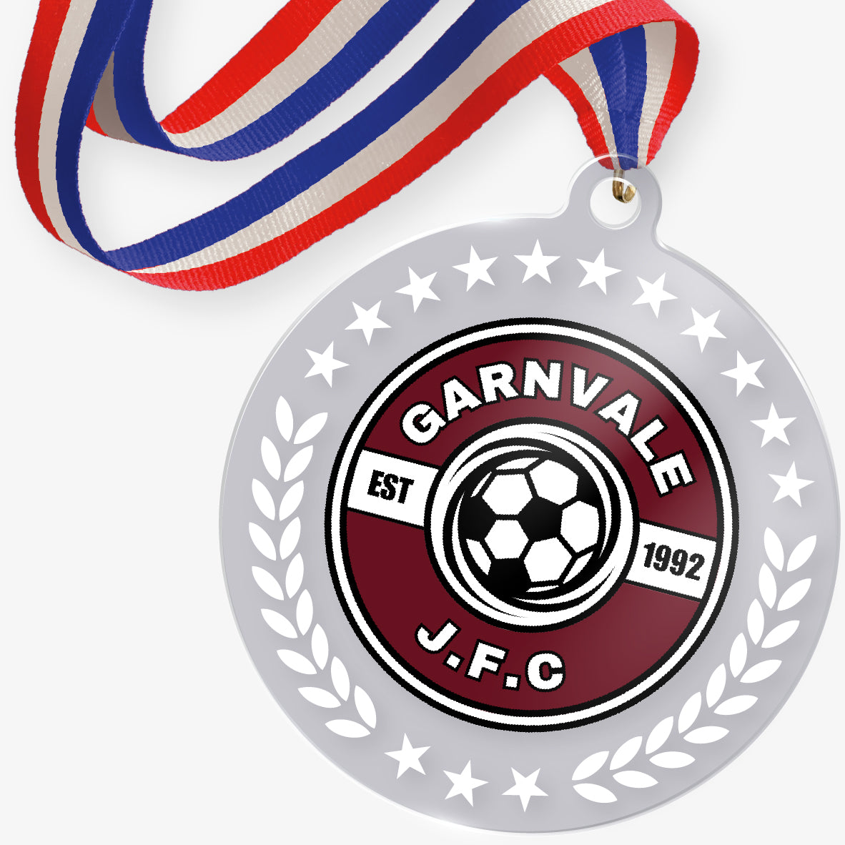 Acrylic medal with a football club logo at it's centre attached to a red, white and blue striped ribbon