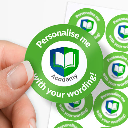 Green stickers with 'Personalise me Academy' text held by a hand on a white background