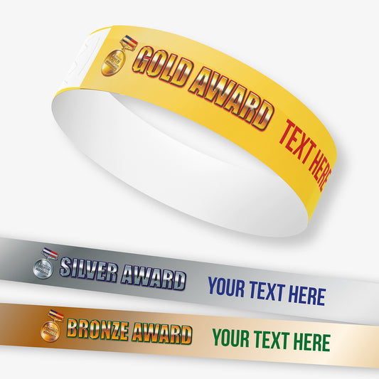 Gold, Silver, and Bronze award ribbons with customizable text on a white background