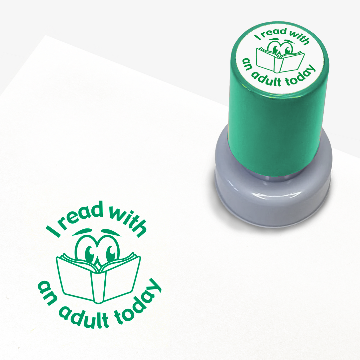 Green ink teacher stamper with 'I read with an adult today' text.