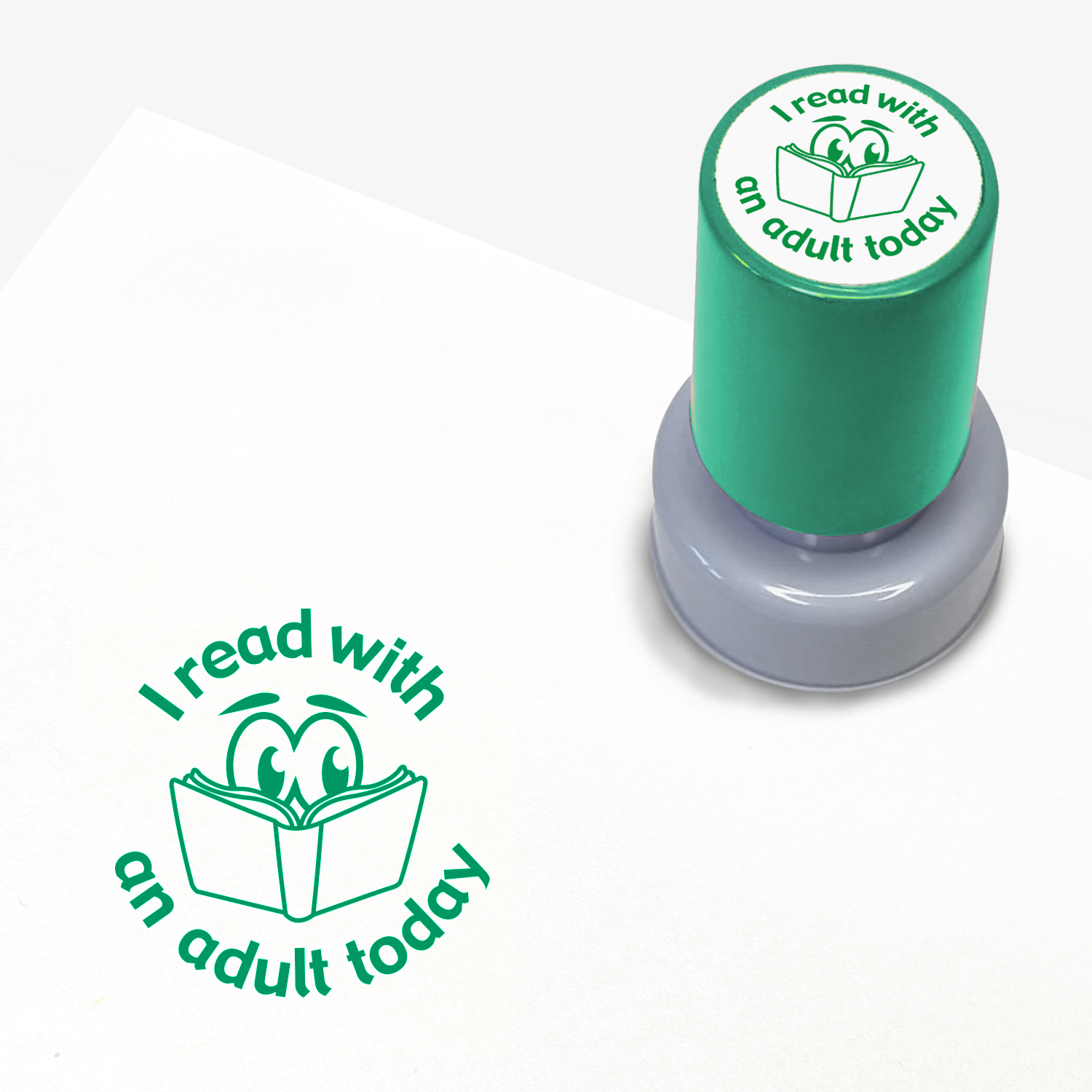 Green ink teacher stamper with 'I read with an adult today' text.