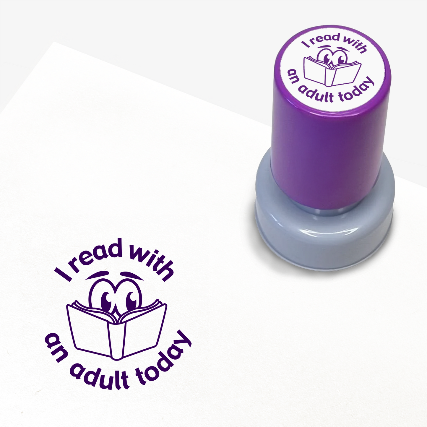 Purple ink teacher stamper with 'I read with an adult today' text.