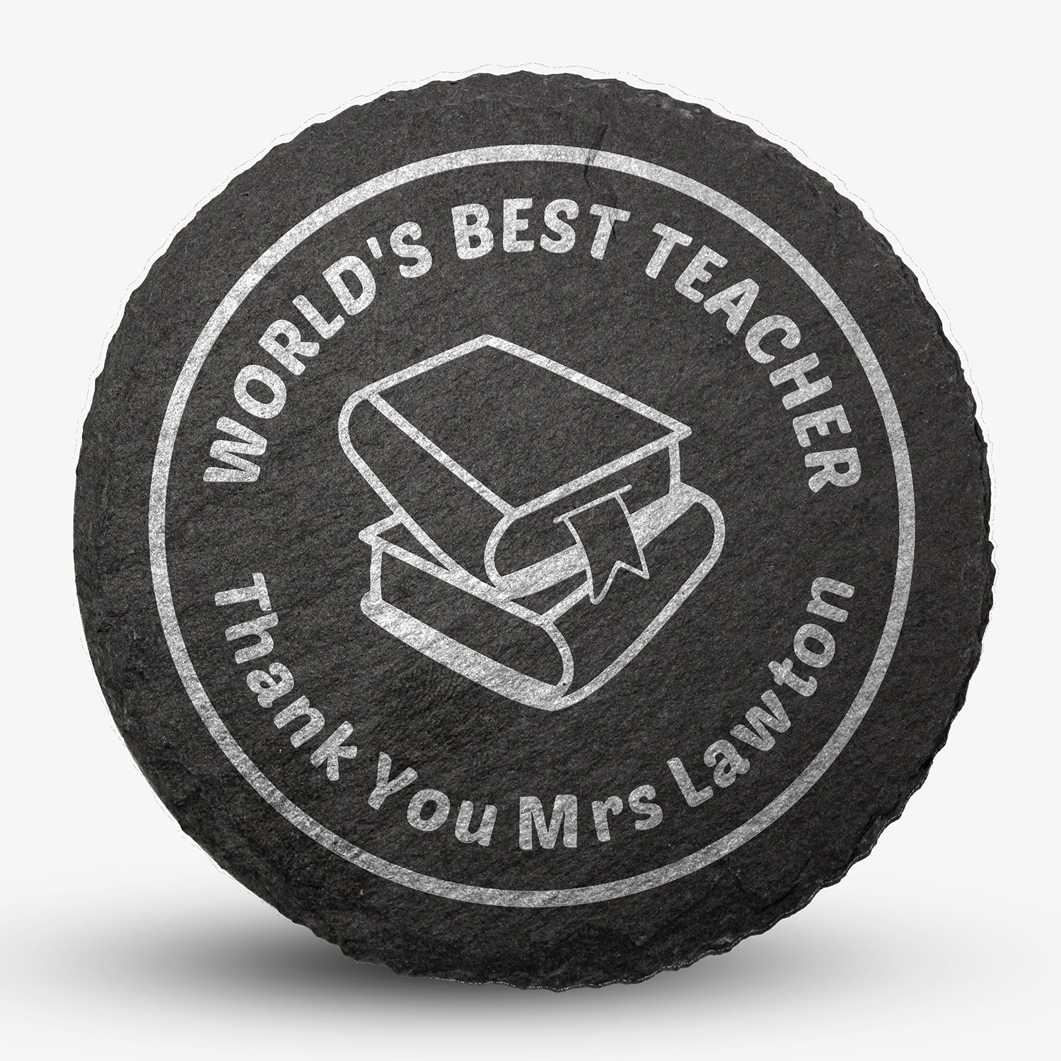Round black slate drinks coaster with engraved placeholder text reading 'WORLD'S BEST TEACHER', Thank You Mrs Lawton', image of two text books stacked on each other, designed for personalisation.