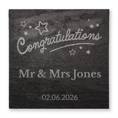 Personalised slate with 'Congratulations Mr & Mrs Jones' and date on a dark background