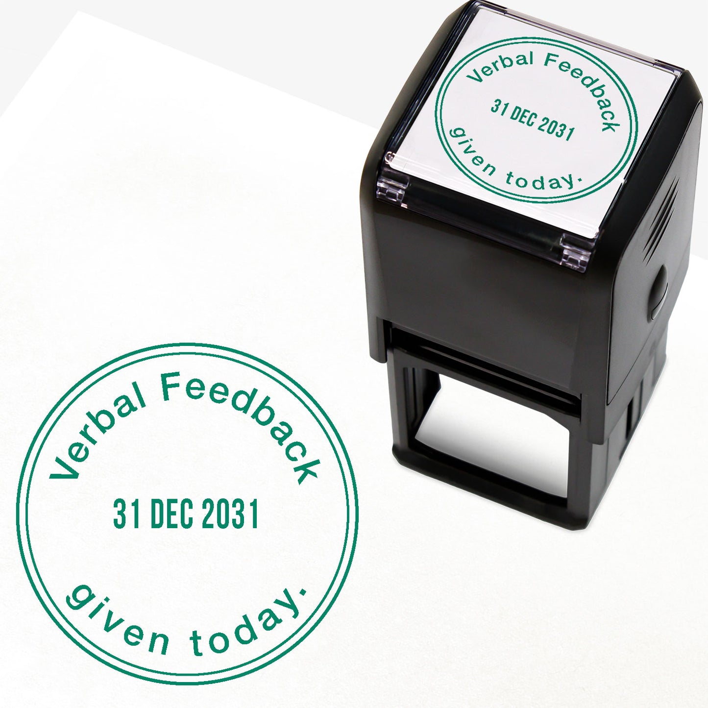 A 38mm circular self-inking teacher stamper with green ink, featuring the phrase "Verbal Feedback given today." curved around the top and bottom edges. The centre displays an adjustable date, and is designed for marking pupils' work to indicate the provision of verbal feedback on a specific date.
