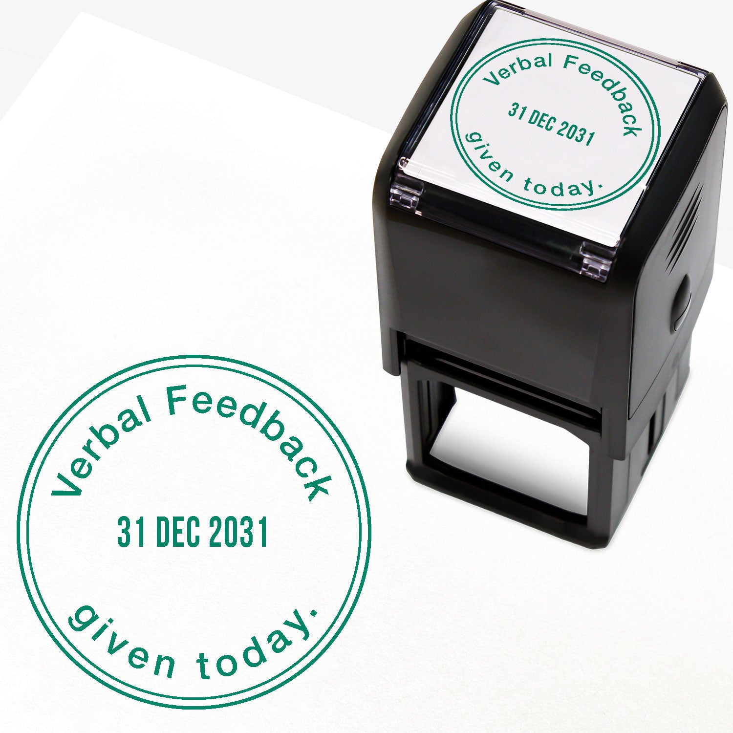A 38mm circular self-inking teacher stamper with green ink, featuring the phrase "Verbal Feedback given today." curved around the top and bottom edges. The centre displays an adjustable date, and is designed for marking pupils' work to indicate the provision of verbal feedback on a specific date.
