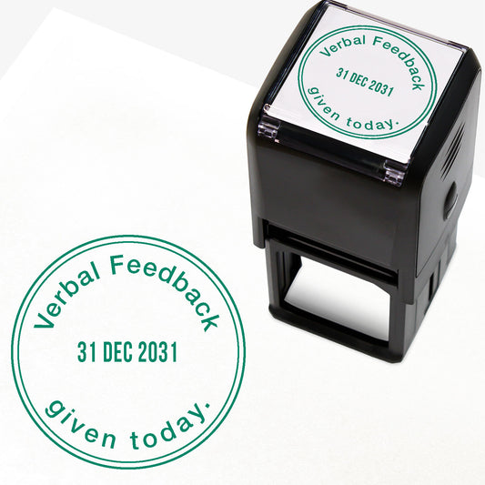 A 38mm circular self-inking teacher stamper with green ink, featuring the phrase "Verbal Feedback given today." curved around the top and bottom edges. The centre displays an adjustable date, and is designed for marking pupils' work to indicate the provision of verbal feedback on a specific date.
