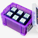 Set of six 25mm self-inking literacy stampers housed in a purple plastic storage box; each stamper features a unique green-inked design to speed up marking
