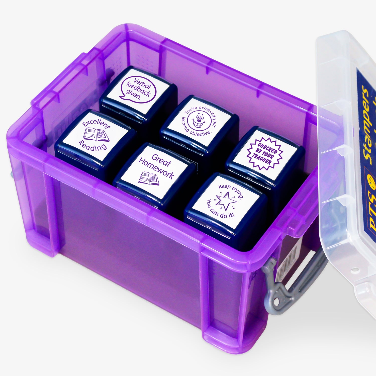 Set of six purple 25mm self-inking literacy stampers housed in a purple plastic storage box; stampers include 'Checked by Your Teacher', Keep Trying. You can do it' alongside reading, homework and learning objective stampers.  