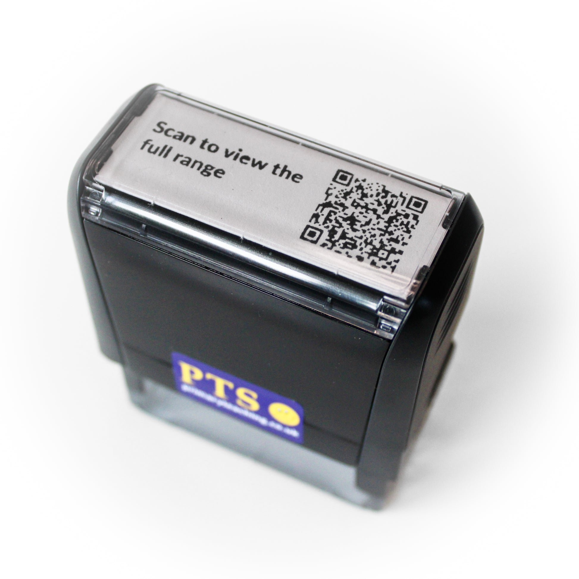 Black self-inking stamp with custom QR code design and the text “Scan to view the full range” printed on the stamp top.