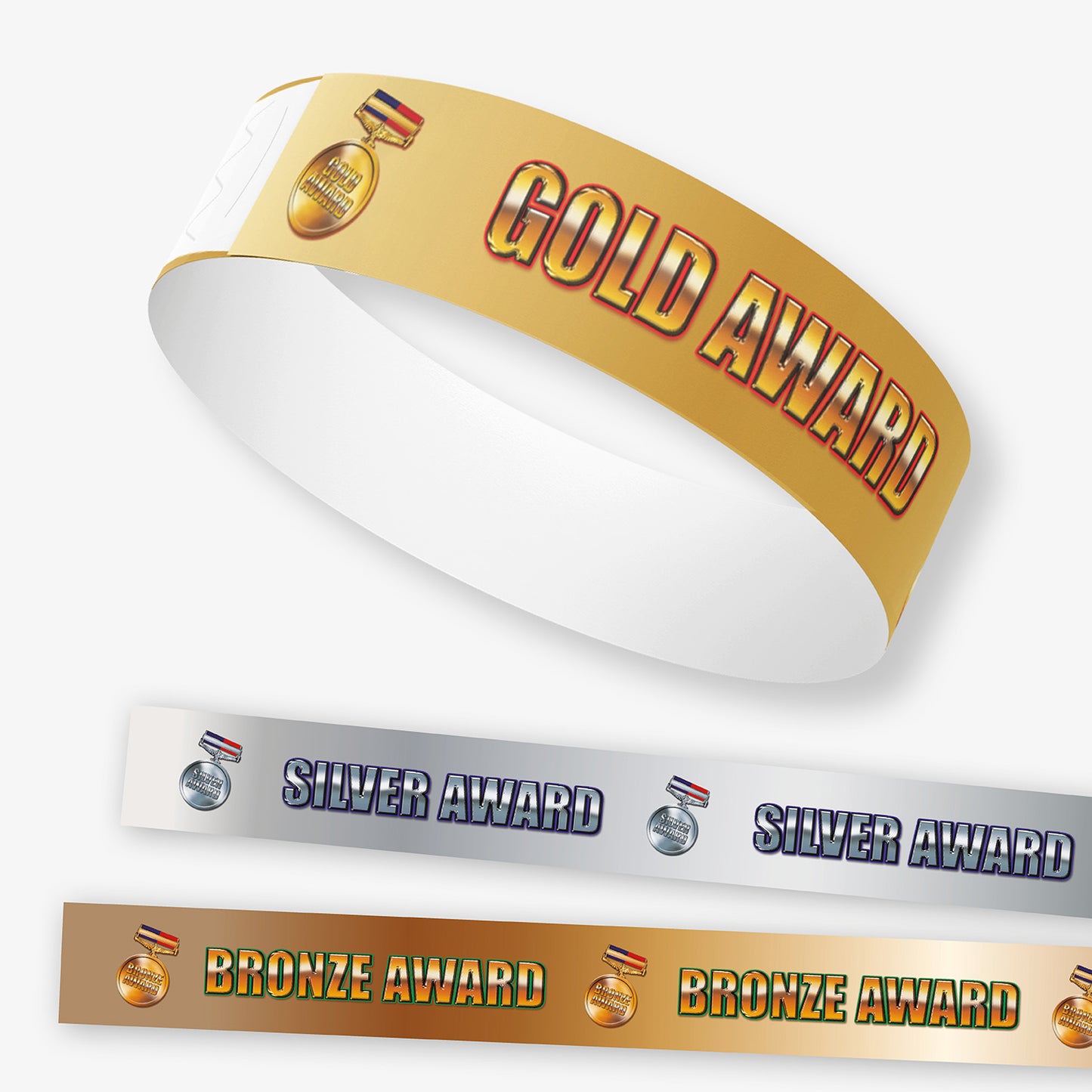 Gold, silver, and bronze award wristbands on a white background