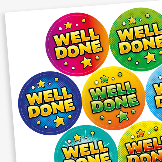 Close-up of colourful 'Well Done' stickers, orange zest scented.