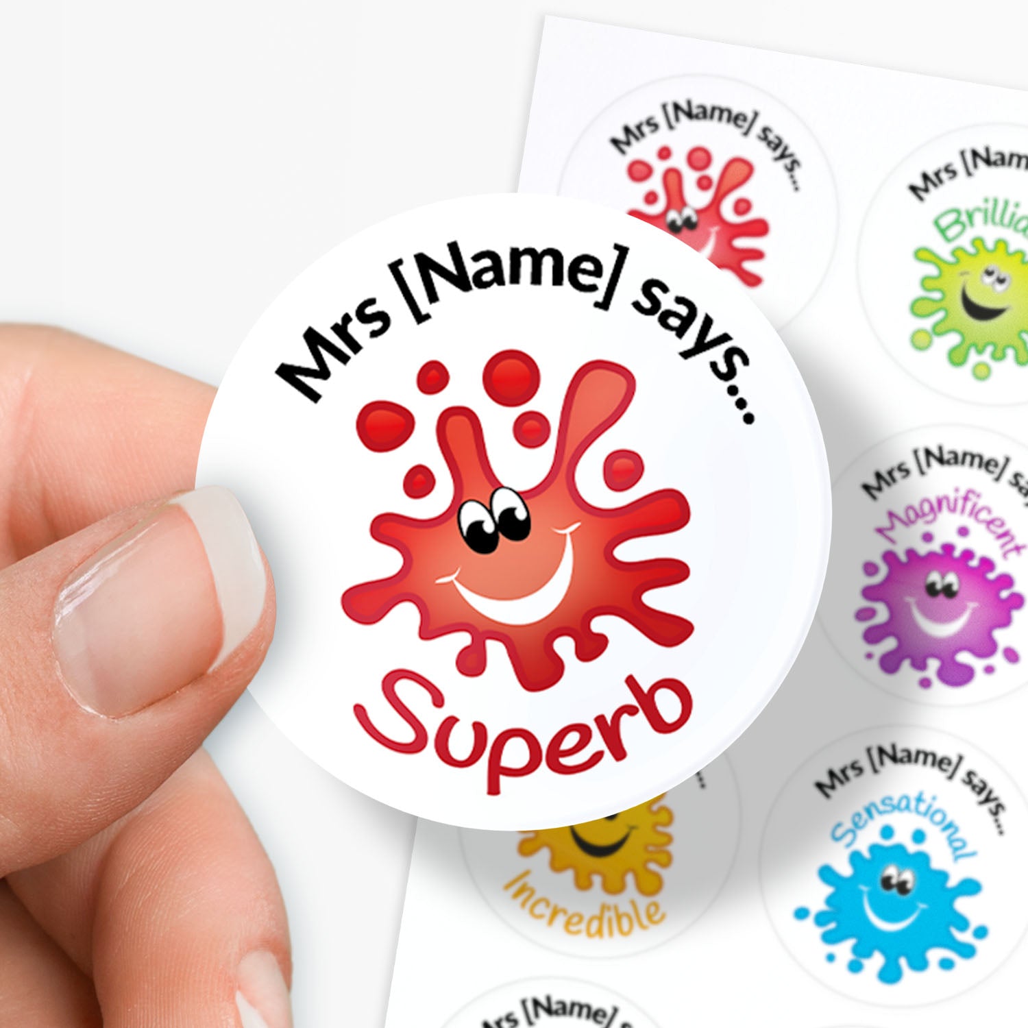 Sticker with 'Mrs [Name] says Superb' text and colorful design held by a hand.