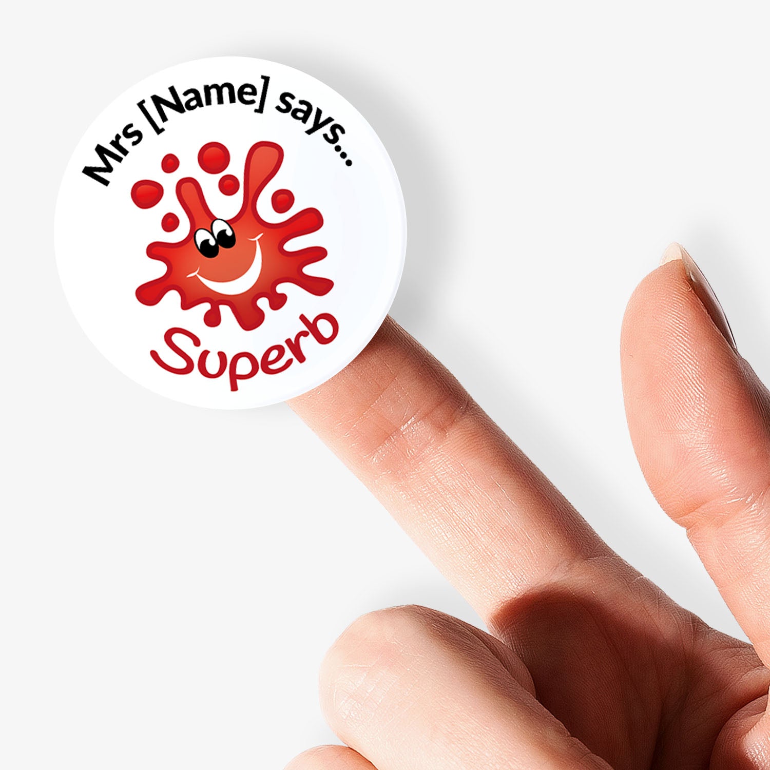 Sticker with a red smiley face and text held by a finger on a white background