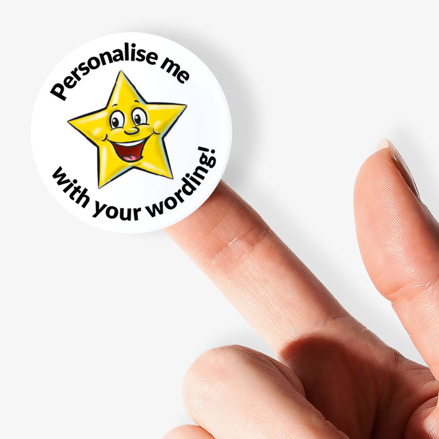 Star-shaped sticker with a smiley face and text 'Personalise me with your wording!' held by a finger.