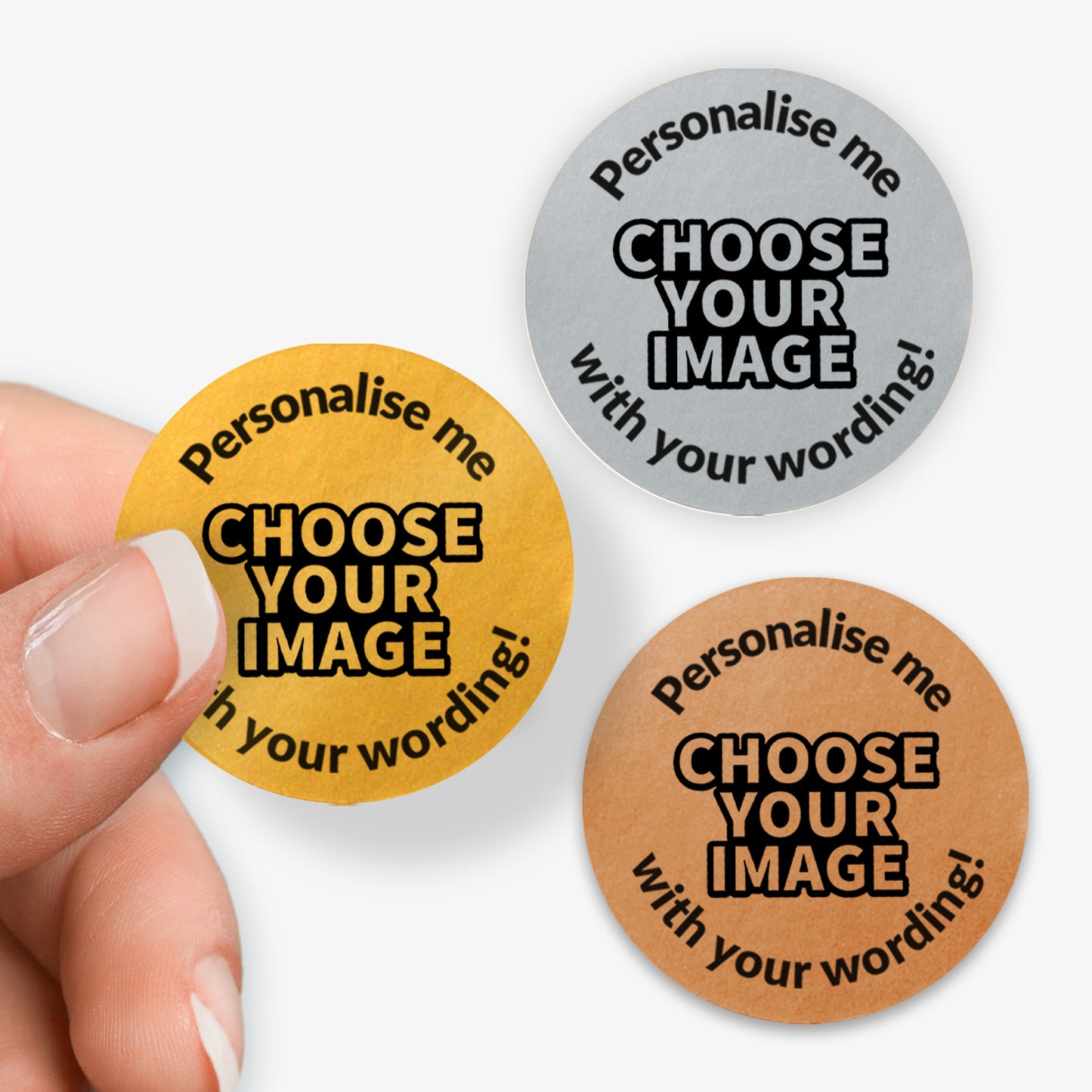 Three round stickers with text 'Personalise me, Choose your image' in Gold, Silver of Bronze held by a hand.