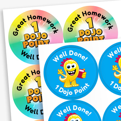 A sheet of circular colourful stickers. The stickers include text reading 'Great Homework', and '1 DOJO POINT', The alternative sticker in the image shows a customised sticker with a blue background, a yellow monster centrally and the surrounding wording of 'Well Done! 1 Dojo Point'