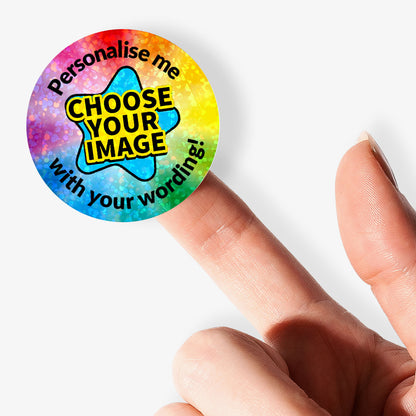 Colorful star-shaped sticker with text 'Personalise me, choose your image with your wording!' held by a finger.