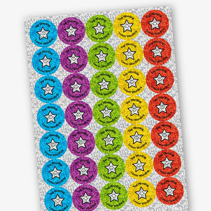 A sheet of circular colourful assorted holographic stickers in red, yellow, cyan, green and purple. The stickers include placeholder text reading 'Top Wording Lower Wording', and Star image.
