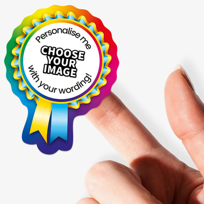 Colorful badge with text 'Personalise me, choose your image with your wording!' held by a hand.