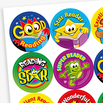A sheet of 32mm round reading reward stickers featuring vibrant designs with cartoon book characters and phrases such as 'Good Reading', 'Star Reader', 'Excellent Reading', and 'Wonderful Reading'. Each sticker showcases a unique colour scheme and cheerful illustration to encourage young readers
