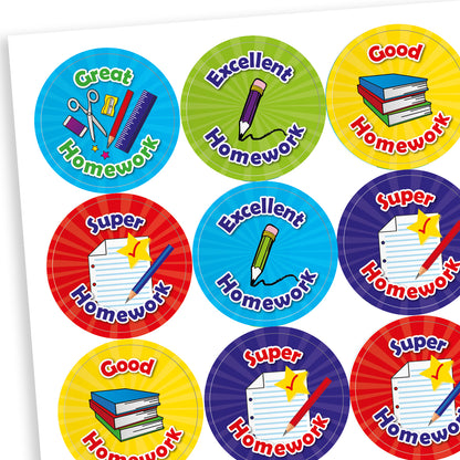 Sheet of 25mm circular reward stickers with vibrant designs and phrases such as 'Great Homework', 'Excellent Homework', 'Good Homework', and 'Super Homework', each featuring illustrations like pencils, books, or paper; designed to commend pupils for outstanding homework submissions.