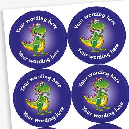 A sheet of purple circular stickers featuring a smiling cartoon T.Rex dinosaur; curving above and below the image is space for personalisation 'Your wording here' in a clear, bold font.