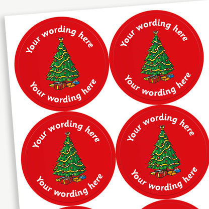 A sheet of customisable circular stickers featuring a red background with a central image of a traditional christmas tree.  Placeholder text 'Your Wording Here' arcs above and below the image.