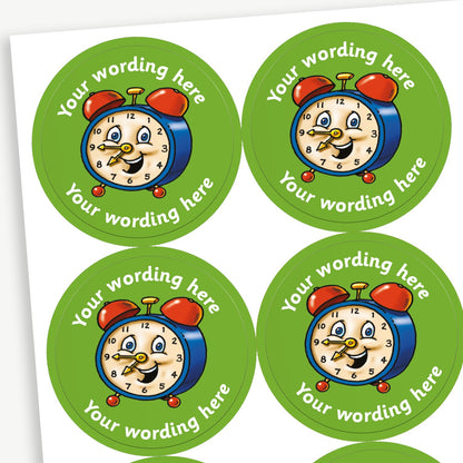 Sheet of round green stickers featuring a smiling cartoon alarm clock in the centre. Each sticker has placeholder text reading 'Your wording here' curved above and below the illustration. 