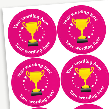 Circular 37mm stickers, magenta in colour and each featuring a golden trophy icon at the centre, surrounded by white stars, with customisable text above and below the trophy - choice of colours
