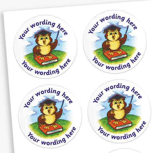 A sheet of white circular stickers featuring a wise owl on a book wearing a mortar board; curving above and below the image is space for personalisation 'Your wording here' in a clear, bold font.