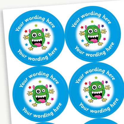 A sheet of cyan bordered stickers featuring an illustration of a green monster on a white background in the centre.  Placeholder text 'Your wording here' is above and below the image for customisation.