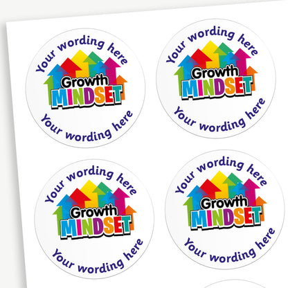 A sheet of round stickers, each with the phrase 'I'm a Growth Mindset Superstar!' in bold, playful text. The word 'Mindset' is especially colourful, with each letter in a different bright colour and arrows pointing upwards above it, symbolising growth. Arcing to the top and the bottom are placeholders 'Your wording here' for customisation.