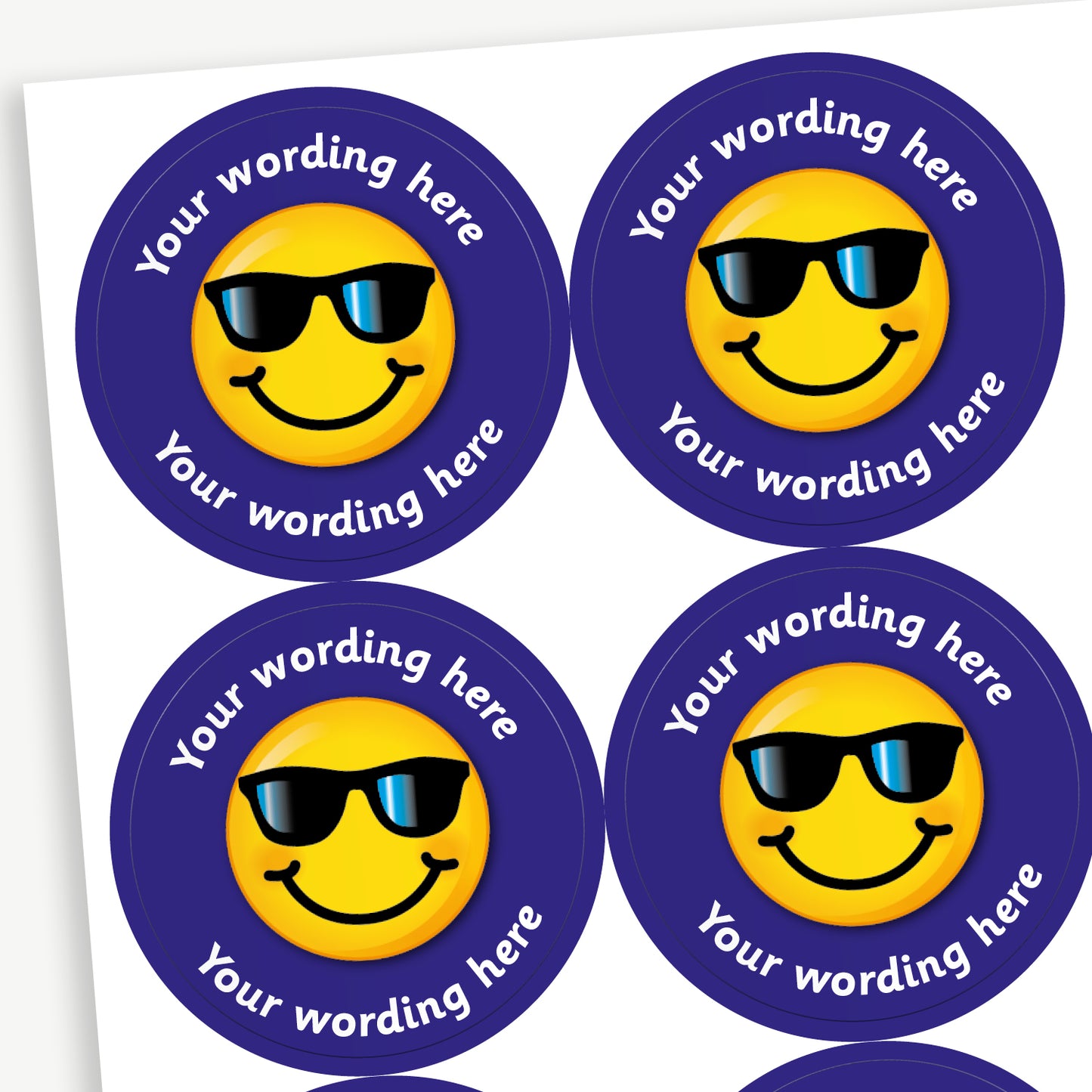 Sheet of 37mm round personalised stickers featuring a smiling emoji wearing sunglasses on a bright background, with customisable text above and below the emoji; designed for rewarding pupils' achievements.