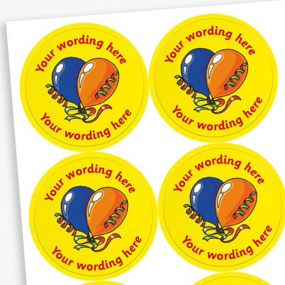 Sheet of round yellow stickers featuring a blue and an orange balloon in the centre. Each sticker has placeholder text reading 'Your wording here' curved above and below the illustration. 