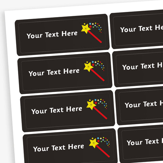 Sheet of rectangular black stickers with white placeholder text reading 'Your Text Here'. Each sticker features a small illustration of a wand emitting a shower of stars.