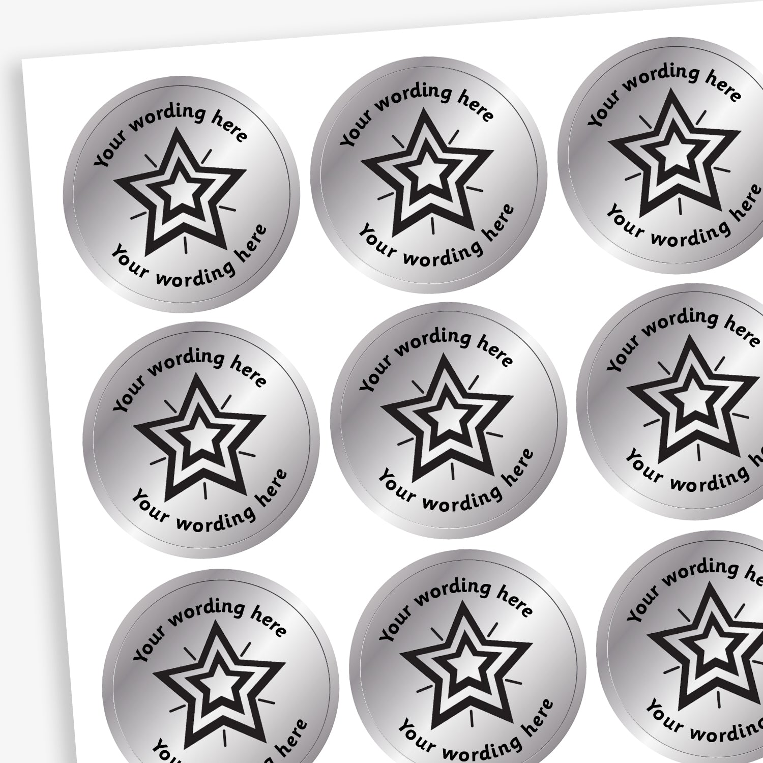 Sheet of 25mm round, metallic silver stickers, each featuring a bold black five-pointed star at the centre. Surrounding the star is placeholder text reading 'Your wording here' above and below, indicating customisable areas for personalised messages
