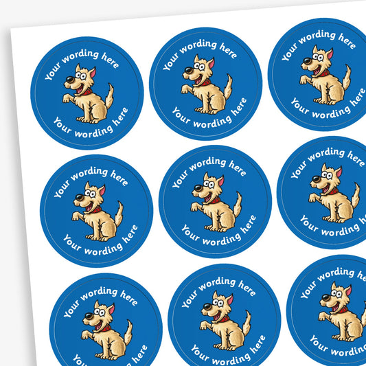 A sheet of circular reward stickers featuring a blue background with a cream dog sat with a paw raised in the centre. Each sticker includes the placeholder text 'Your wording here' curved along the top and bottom edges, indicating customisable space for personalised messages